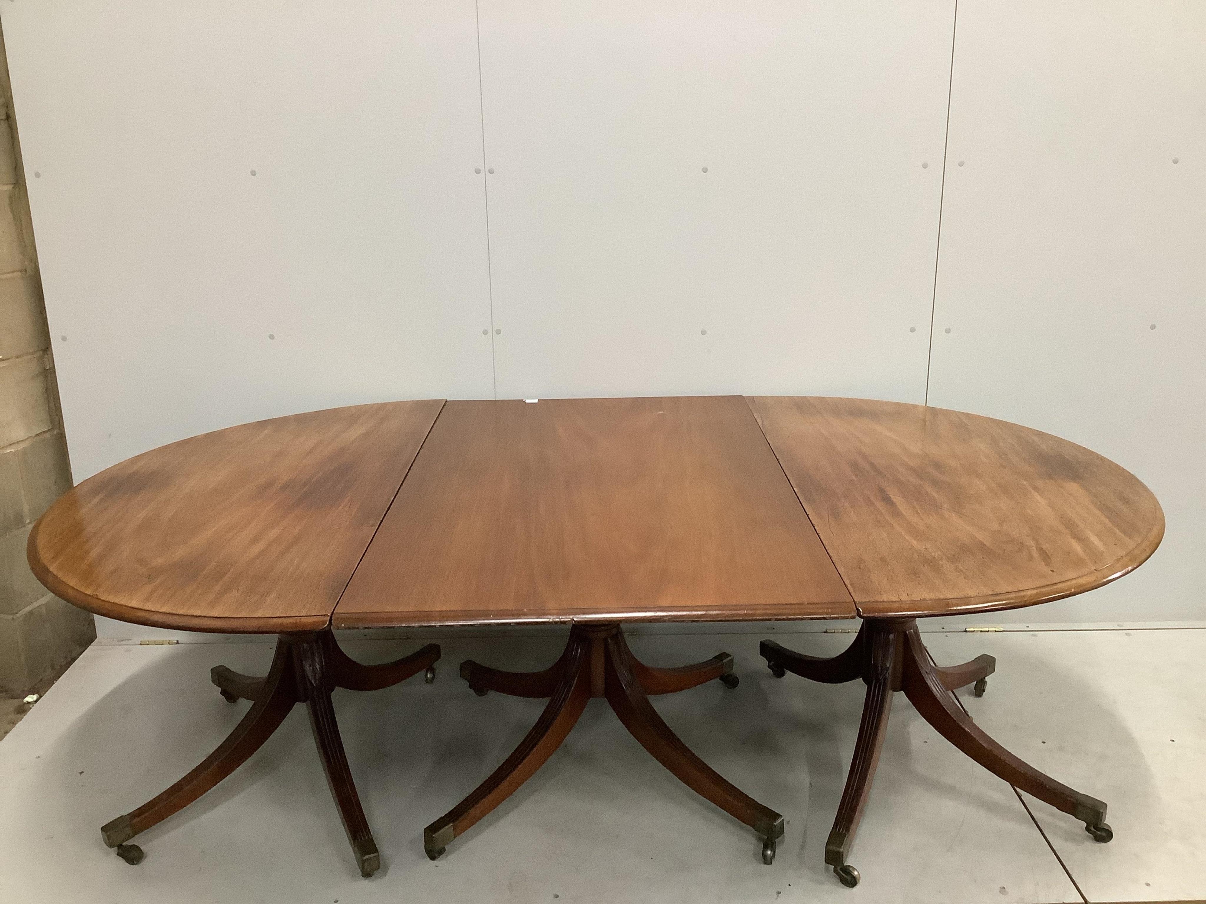 A Regency mahogany D end extending dining table, 232cm extended, one spare leaf, depth 140cm, height 73cm. Condition - poor to fair